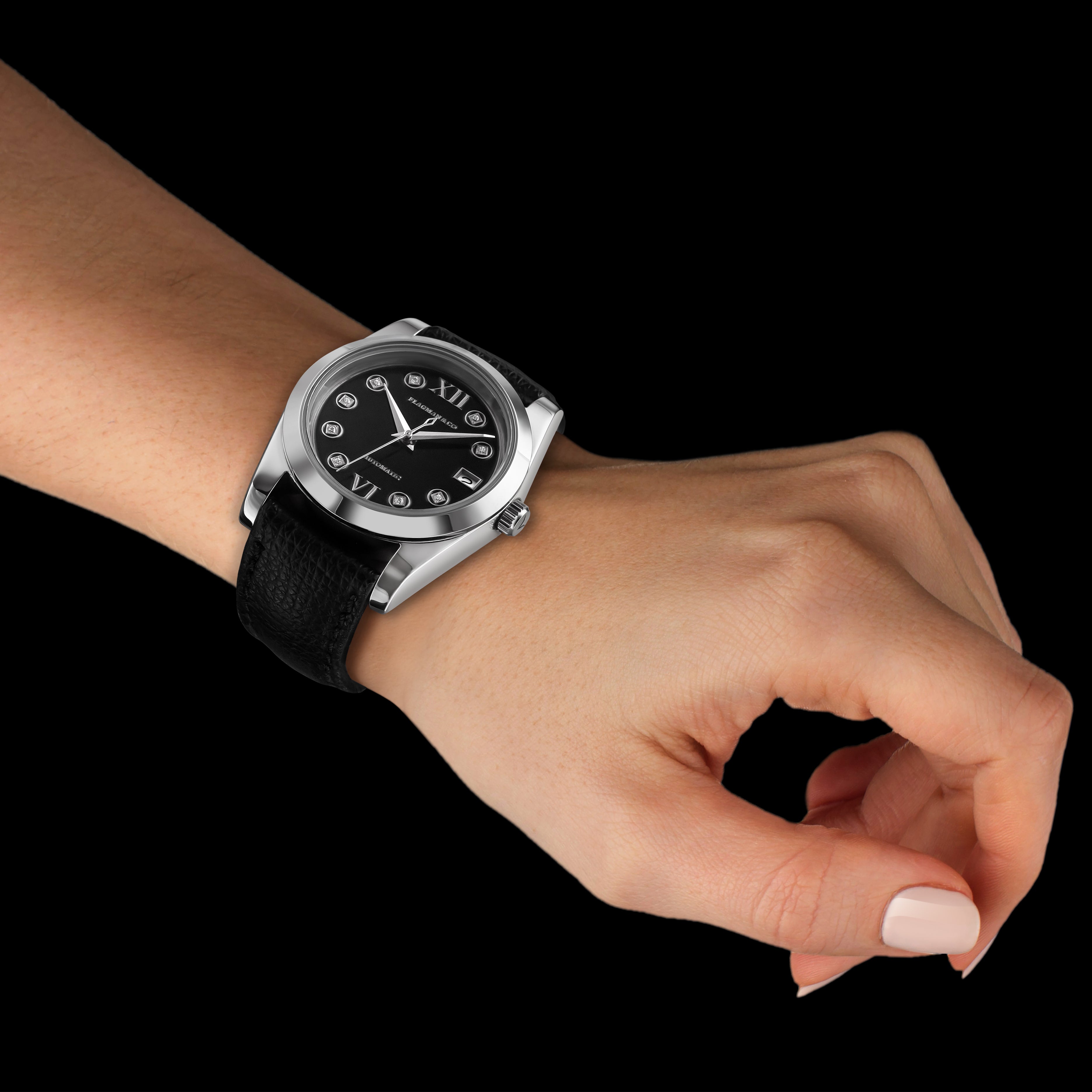 Hand wearing a black wristwatch with a black dial on a transparent background