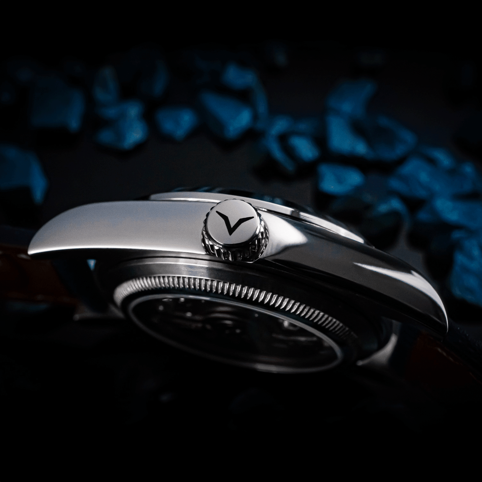 Side view of handmade watch Lumine blue featuring its crown