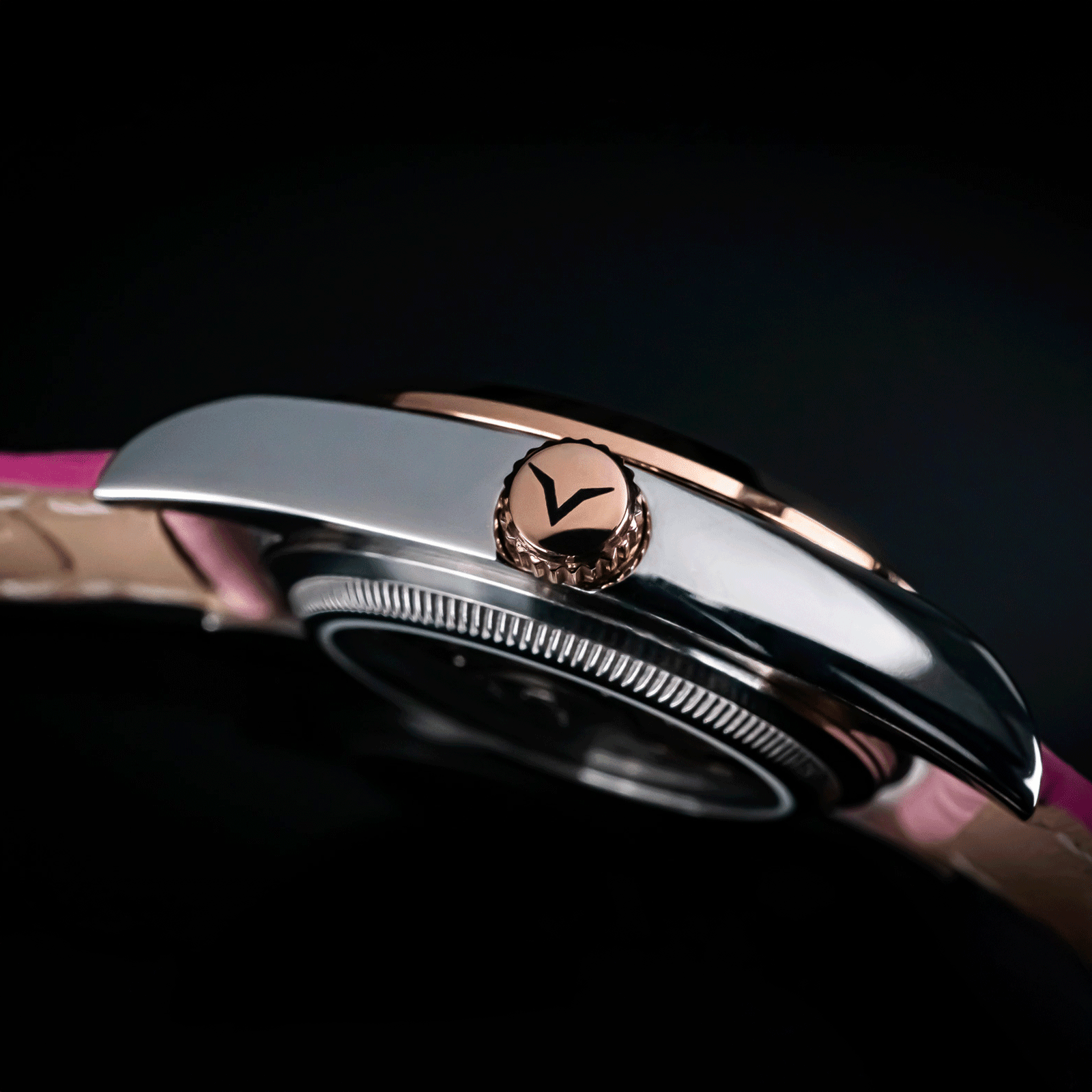 Side view of handmade watch Lumine pink featuring its crown