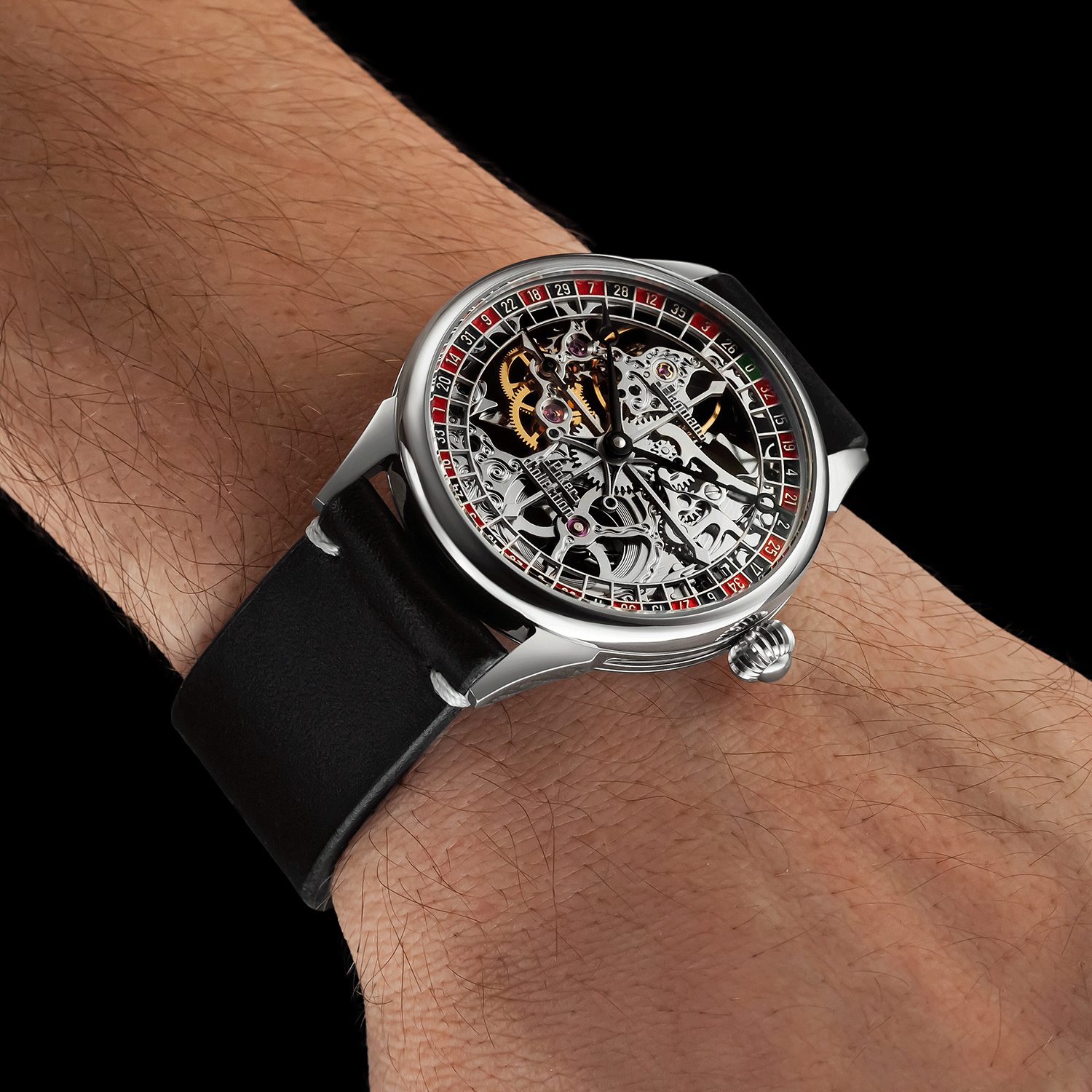 Front view of handmade skeleton watch worn on wrist –roulette-inspired design