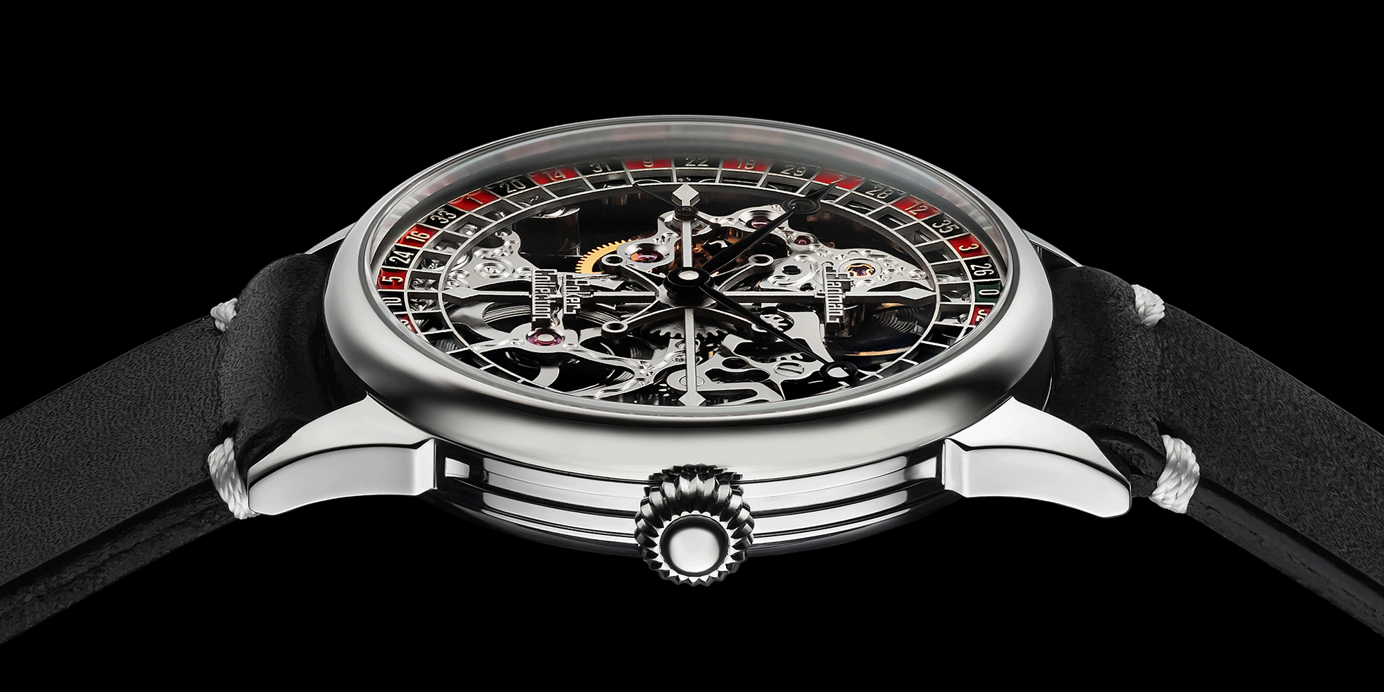 Close-up of poker-themed skeleton watch crown – wornon wrist, handcrafted detail visible