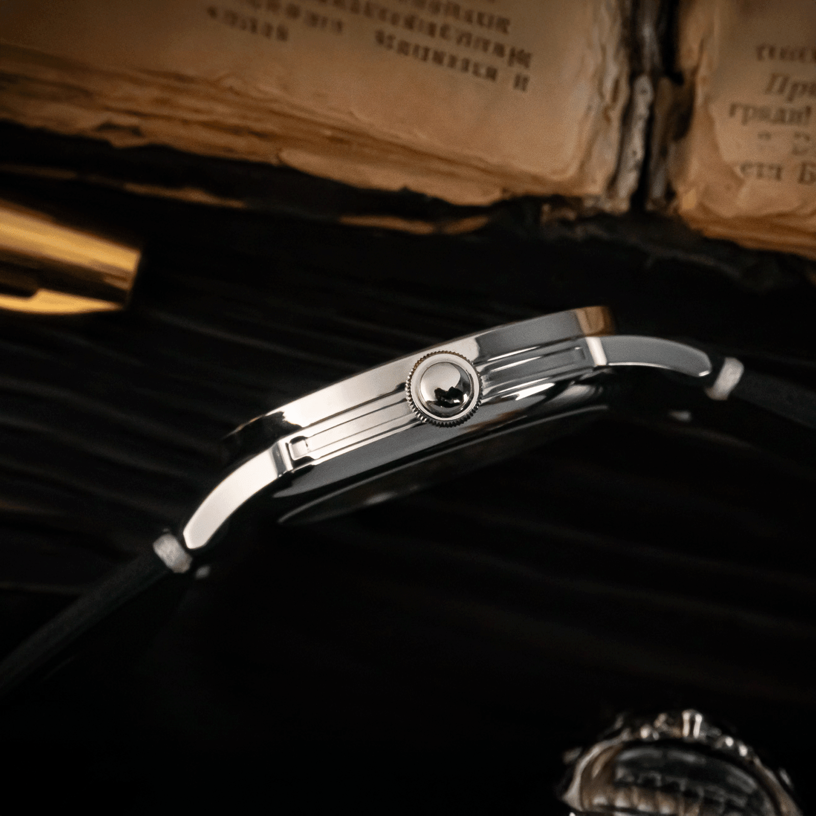 Temple Skeleton watch with black strap, and its crown.