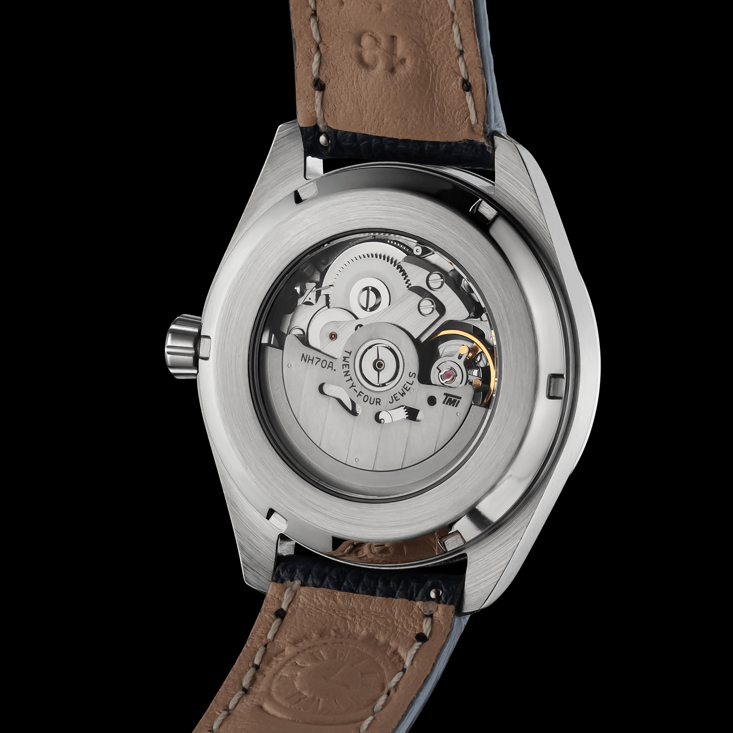 Watch back view with visible mechanical components on a black background