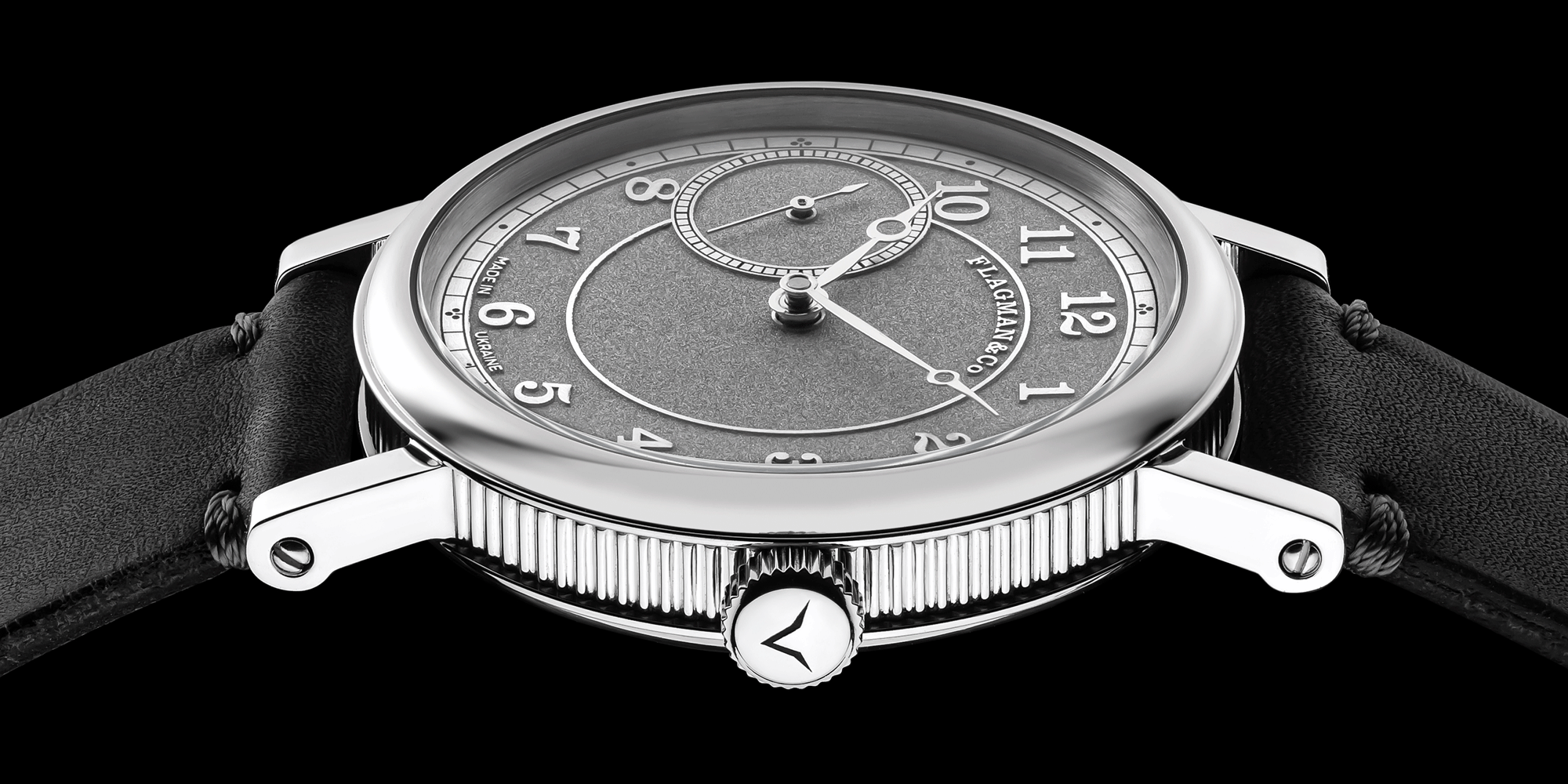 Handmade watch with gray leather strap on a black background