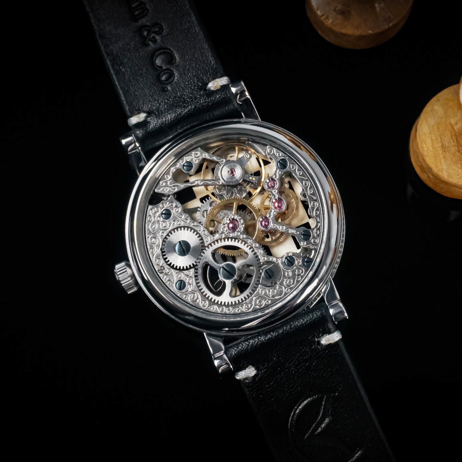Rear view of Checkmate watch showing skeleton caseback and manual winding movement