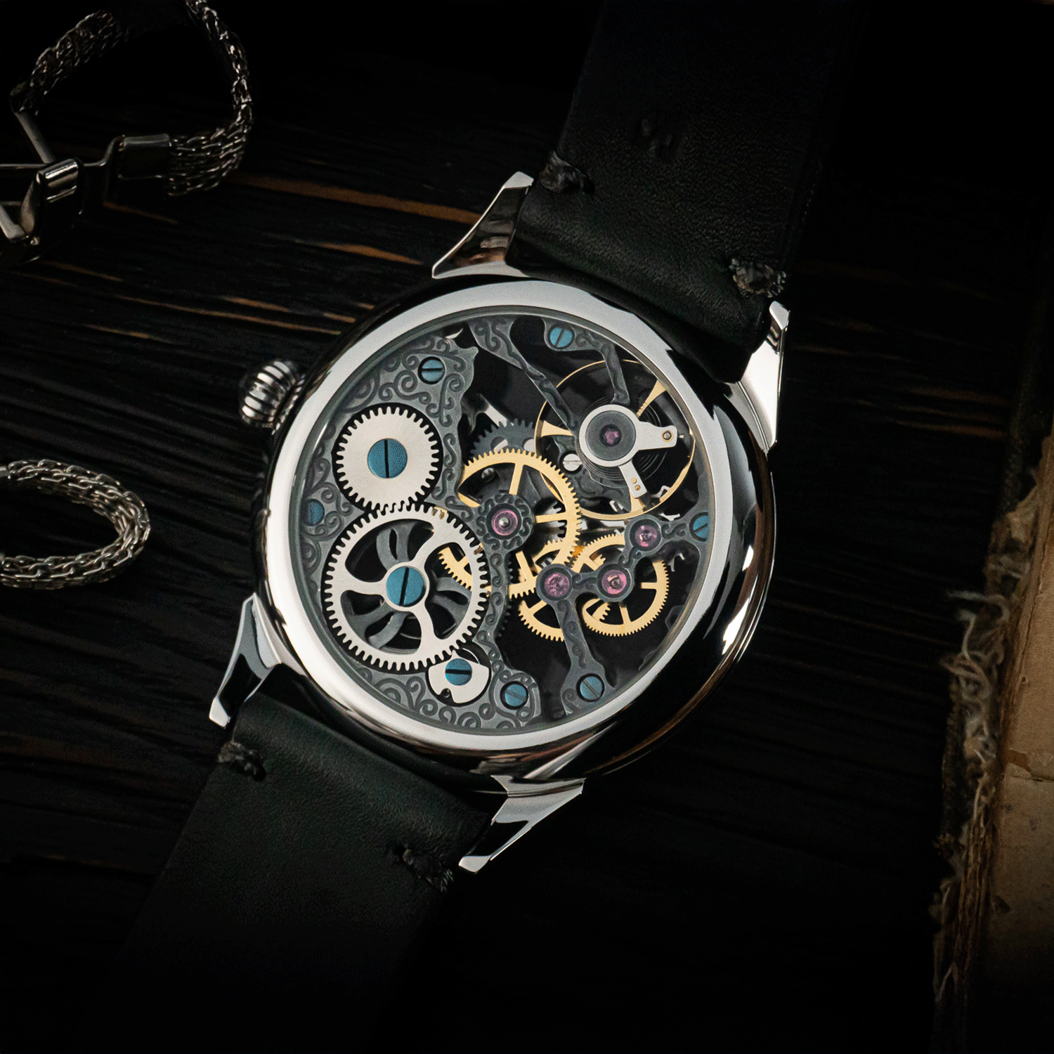 Rear view of Graphite watch showing skeleton caseback and manual winding movement