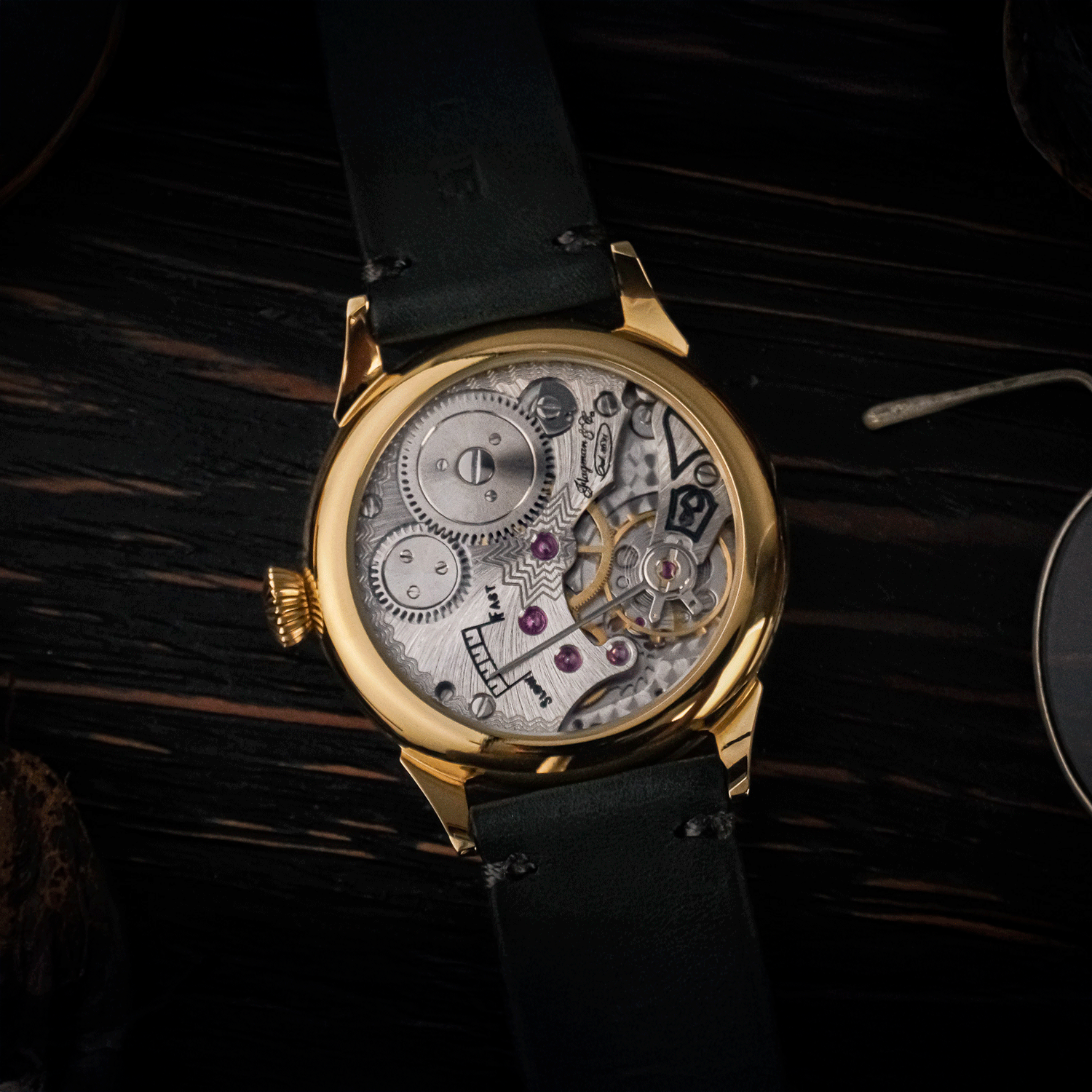 Rear view of Bohemia showing open caseback and manual winding movement