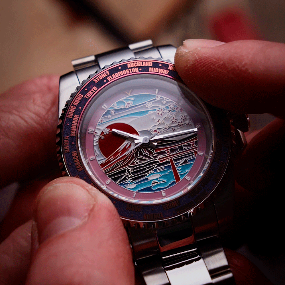 Close-up of a person holding a detailed wristwatch with artistic design