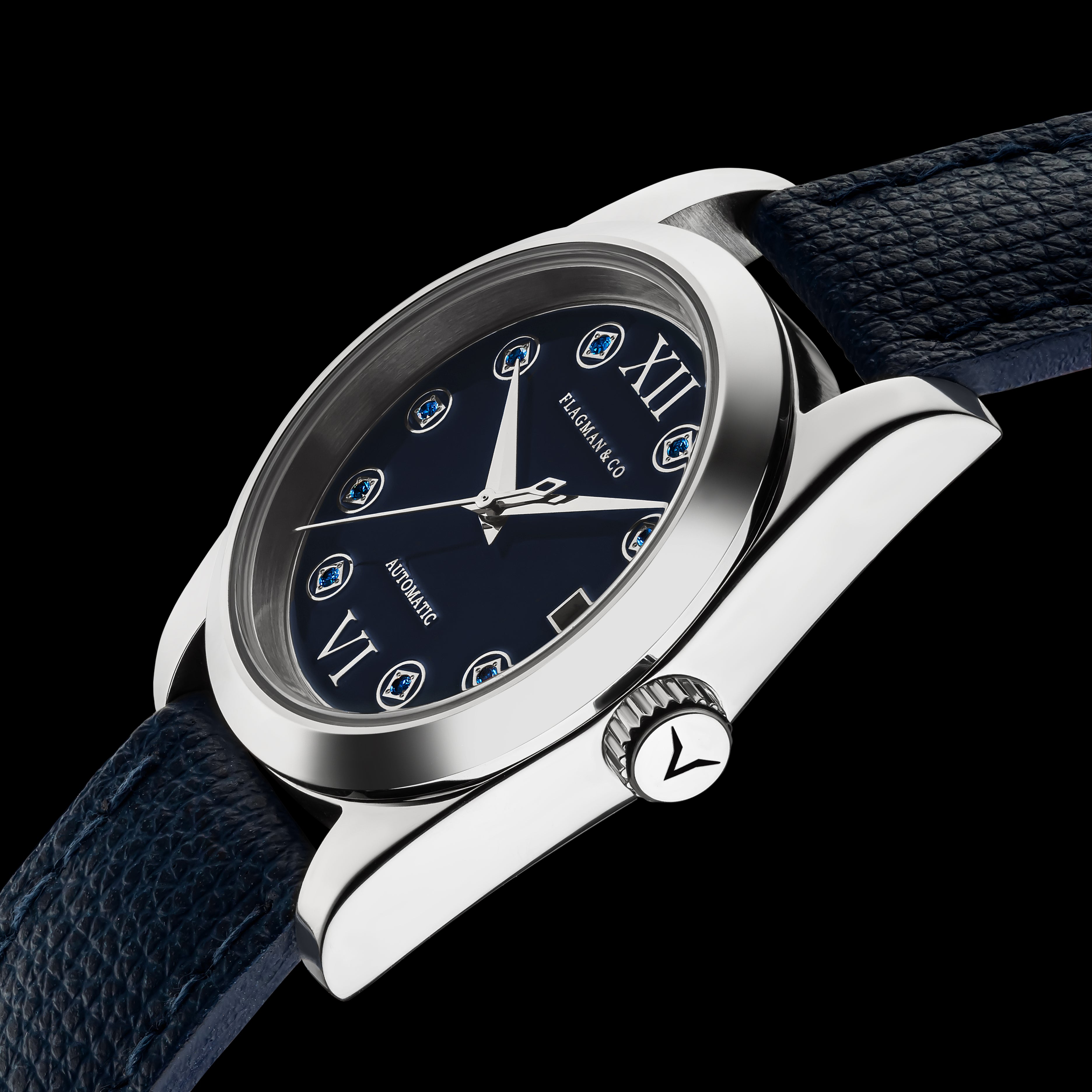 Luxury watch with blue strap and black dial on a black background