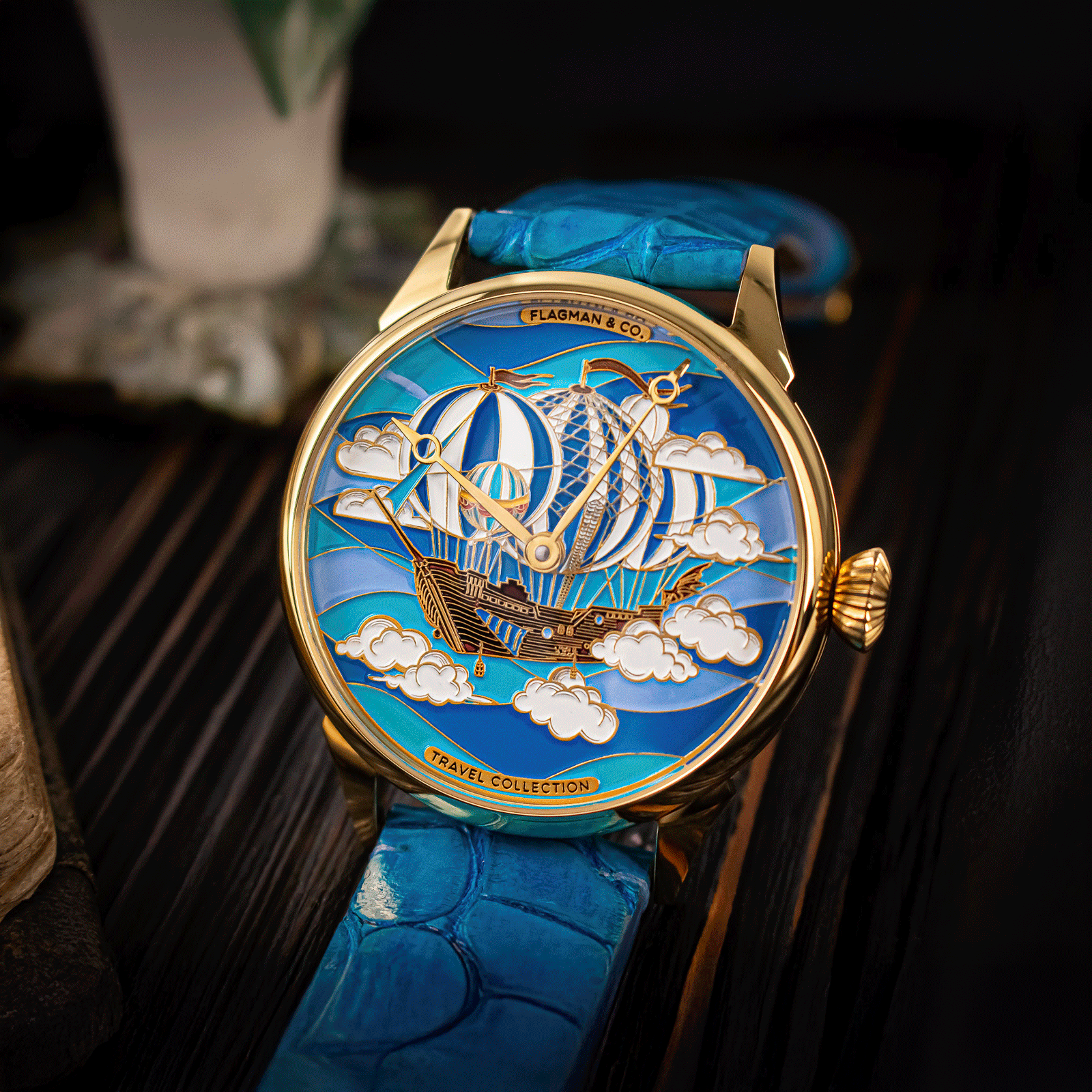 Luxury watch with blue strap and intricate design on face