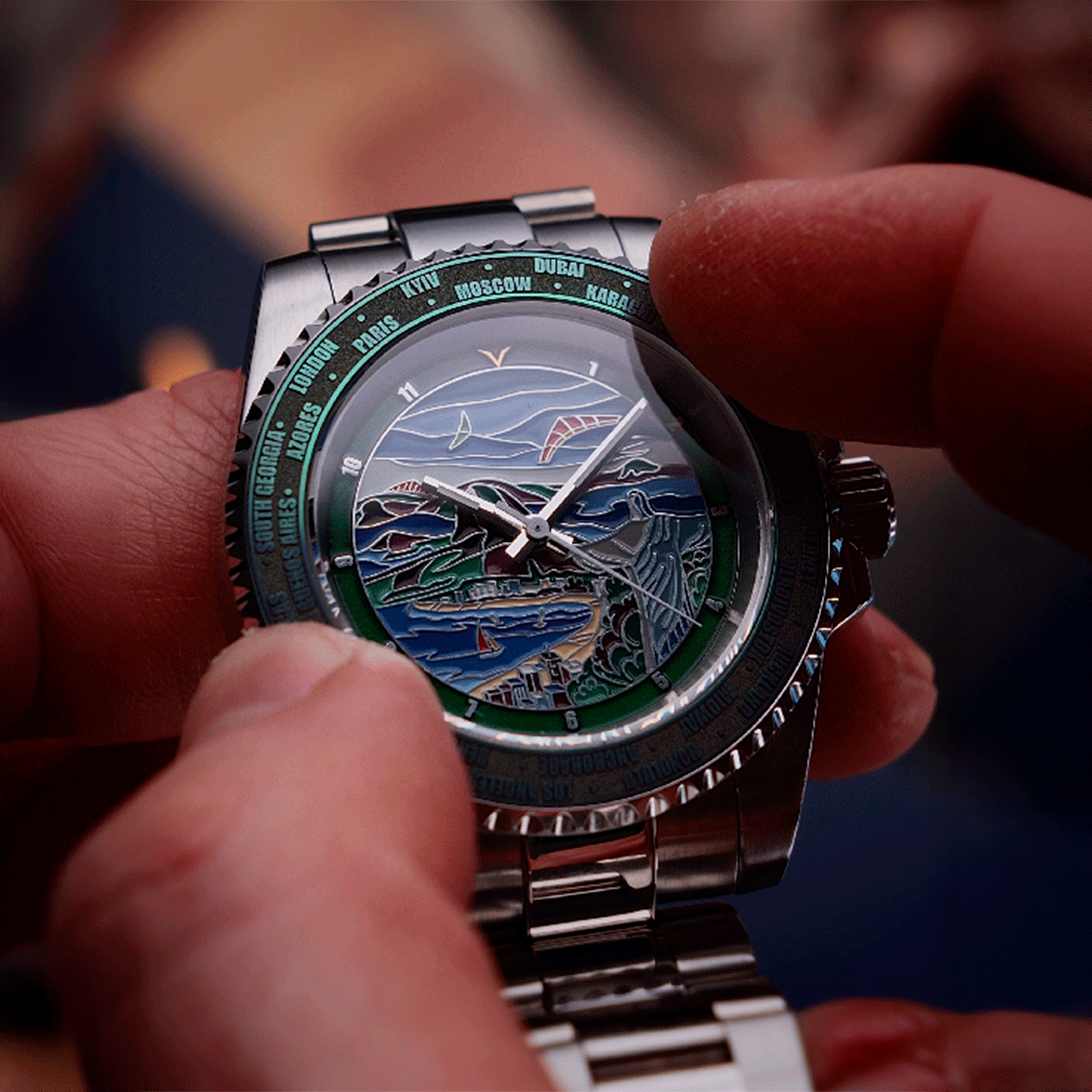 Close-up of a person holding a silver watch with a detailed face.