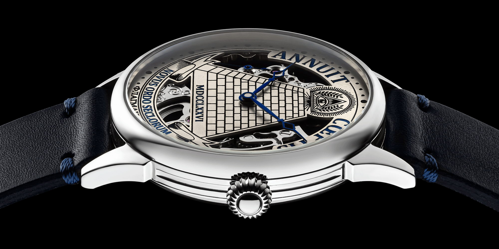 Skeleton watch with detailed face and blue strap on a black background