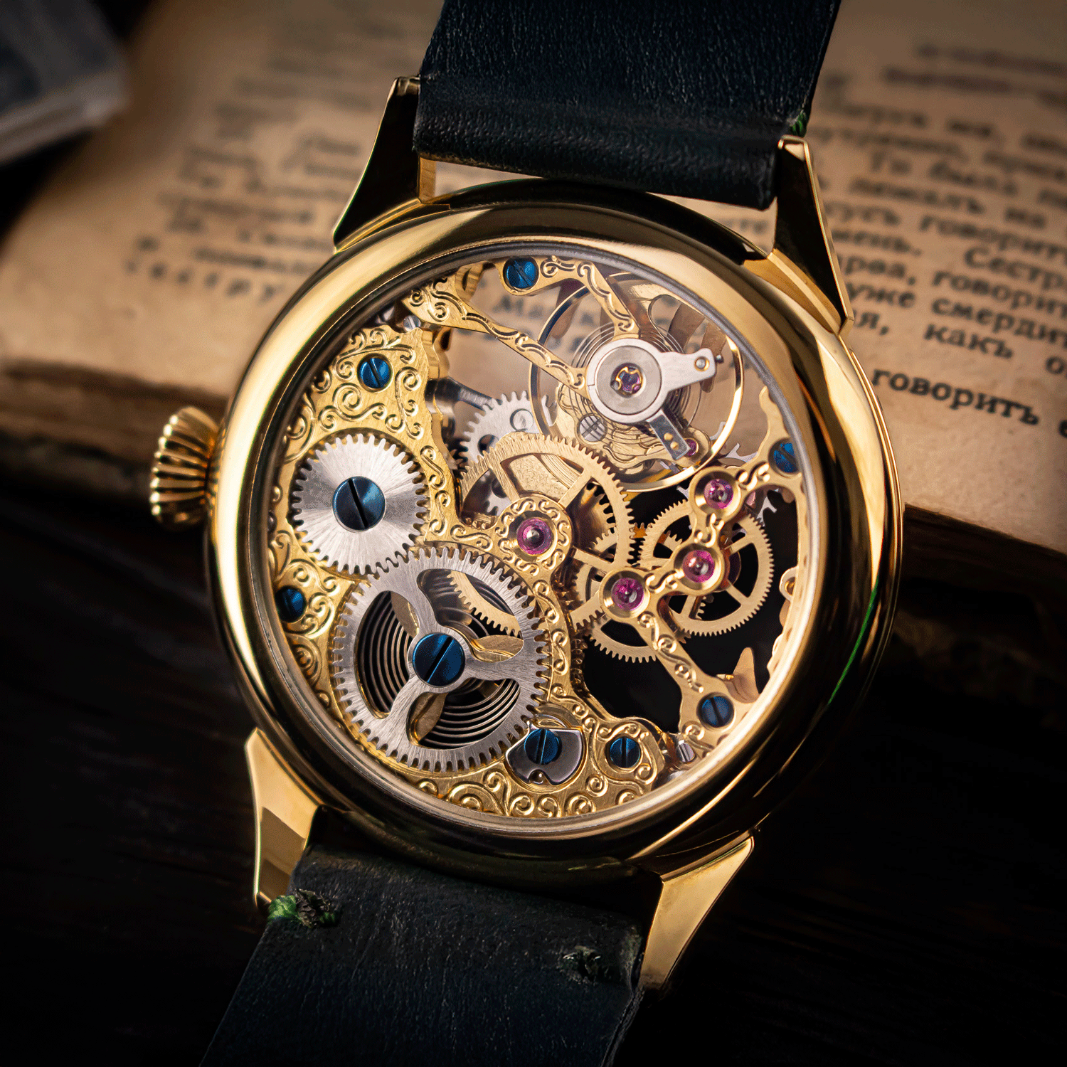 Gold mechanical watch with visible gears on a dark background