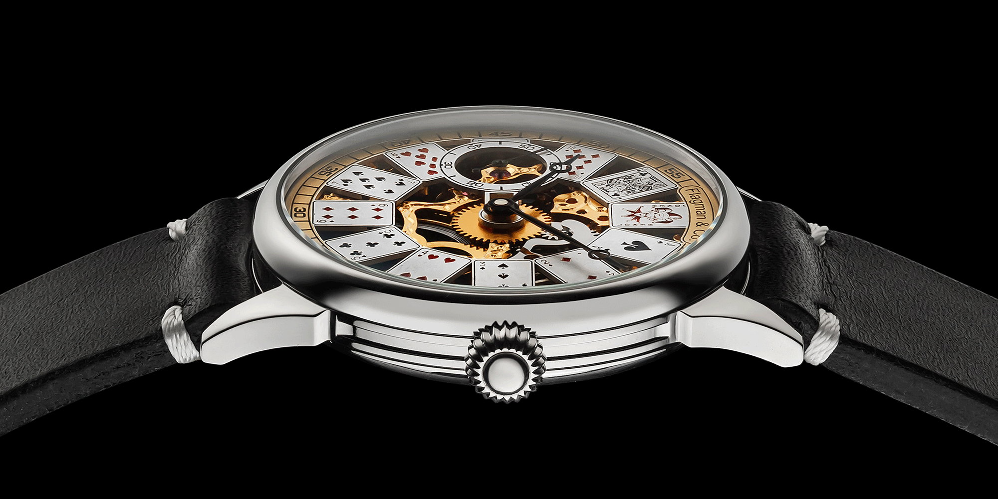 Close-up of poker-themed skeleton mechanical watch crown – worn on wrist, handcrafted detail visible