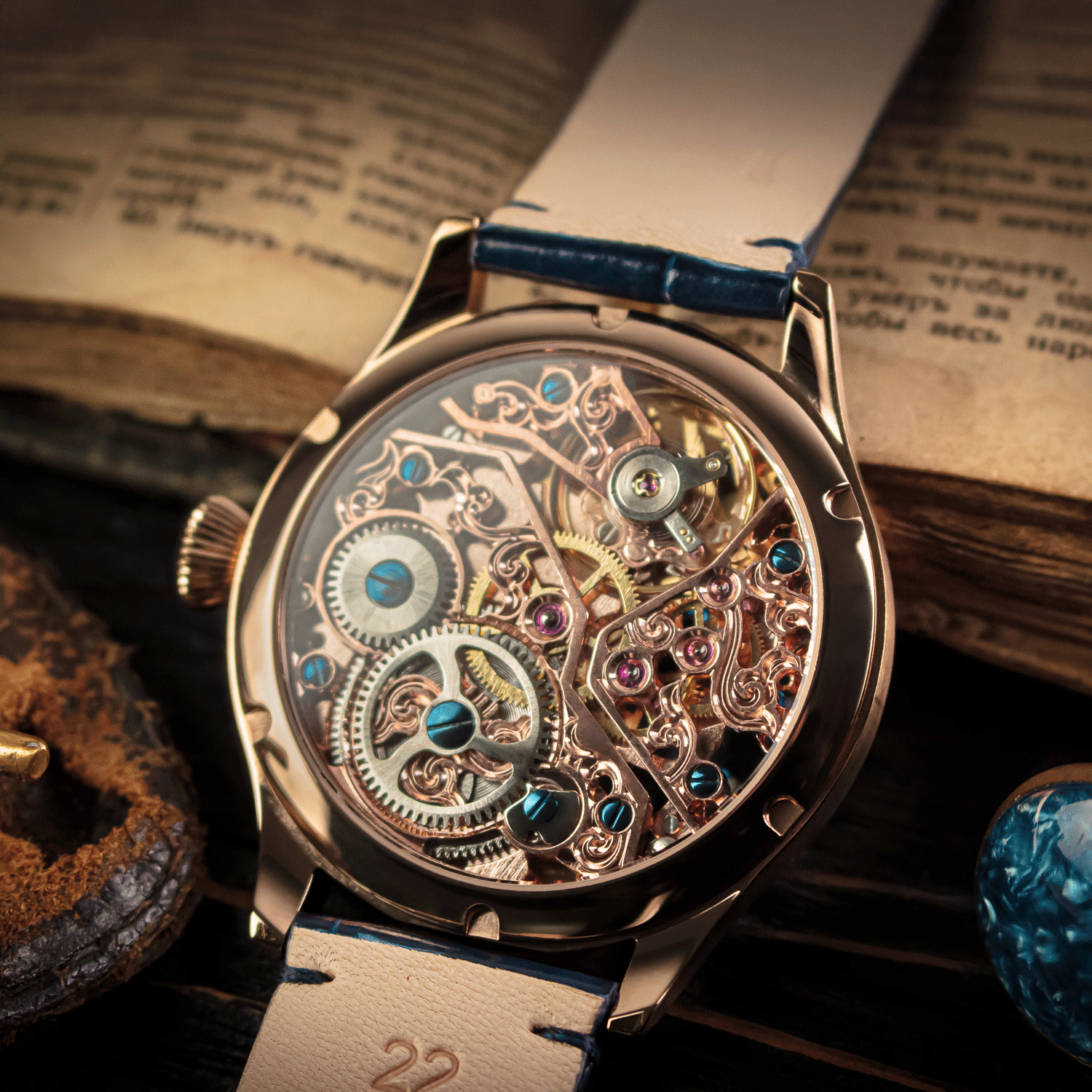 Mechanical watch with visible gears on a textured surface