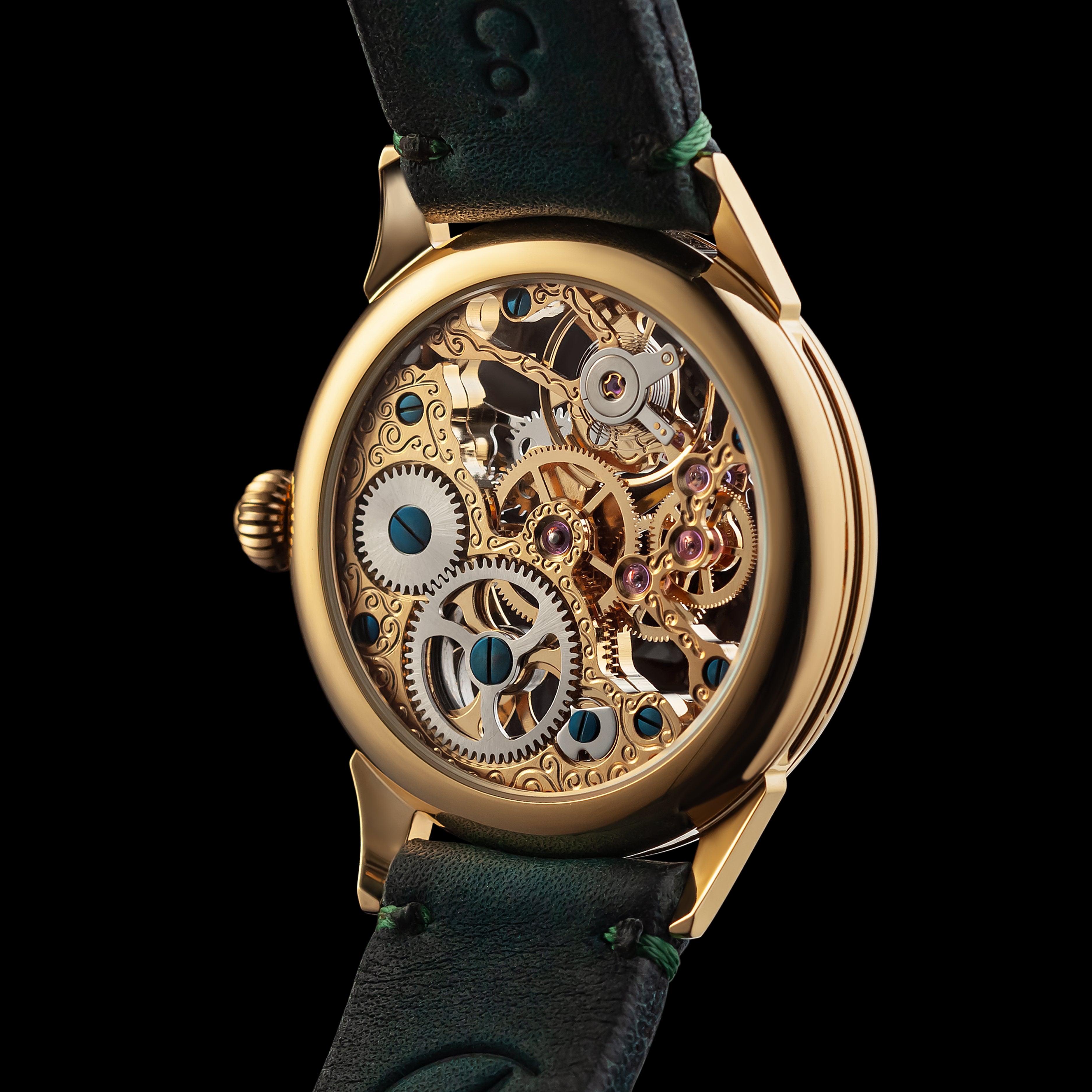 Gold mechanical watch with visible gears on a black background
