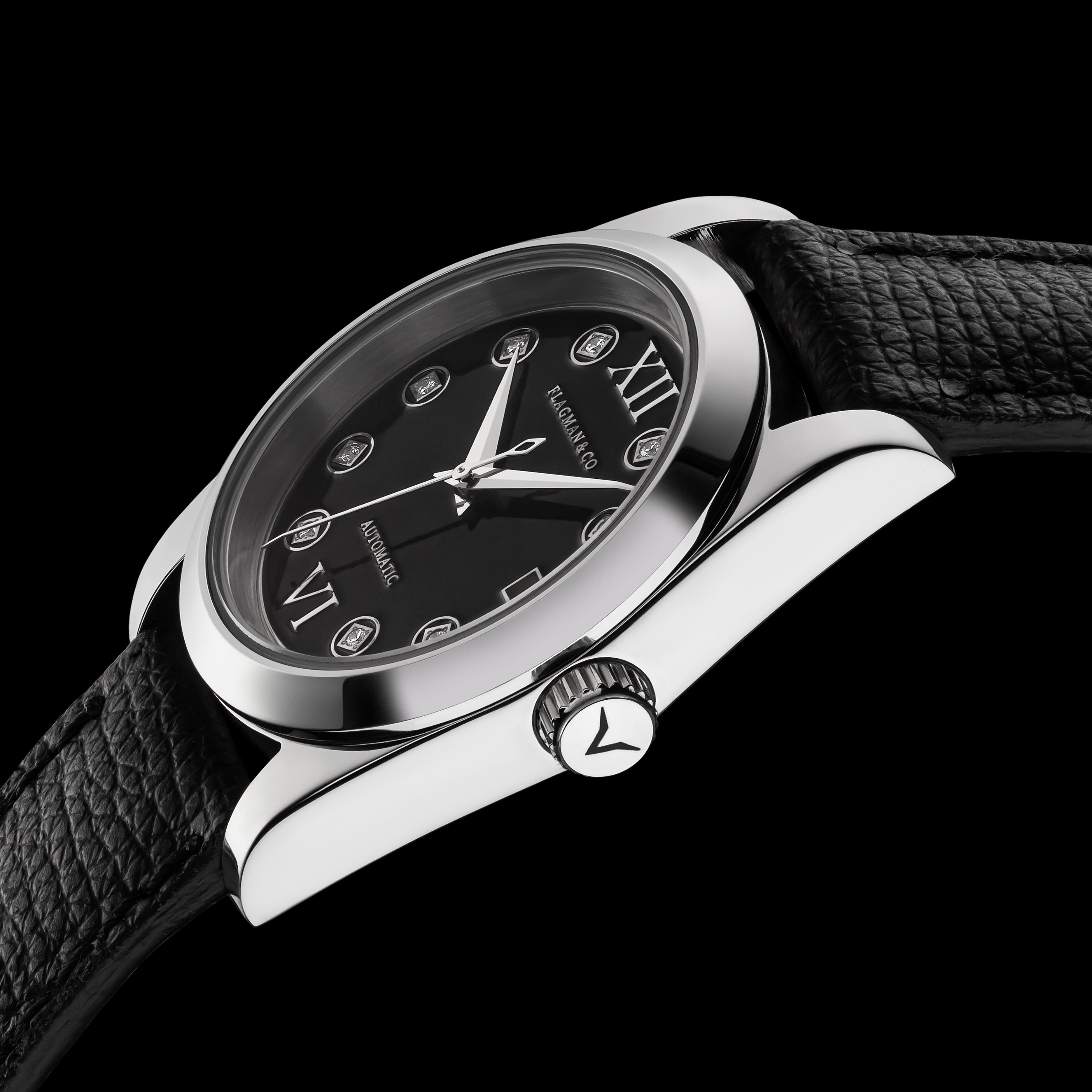 Wristwatch with black dial and leather strap on a black background