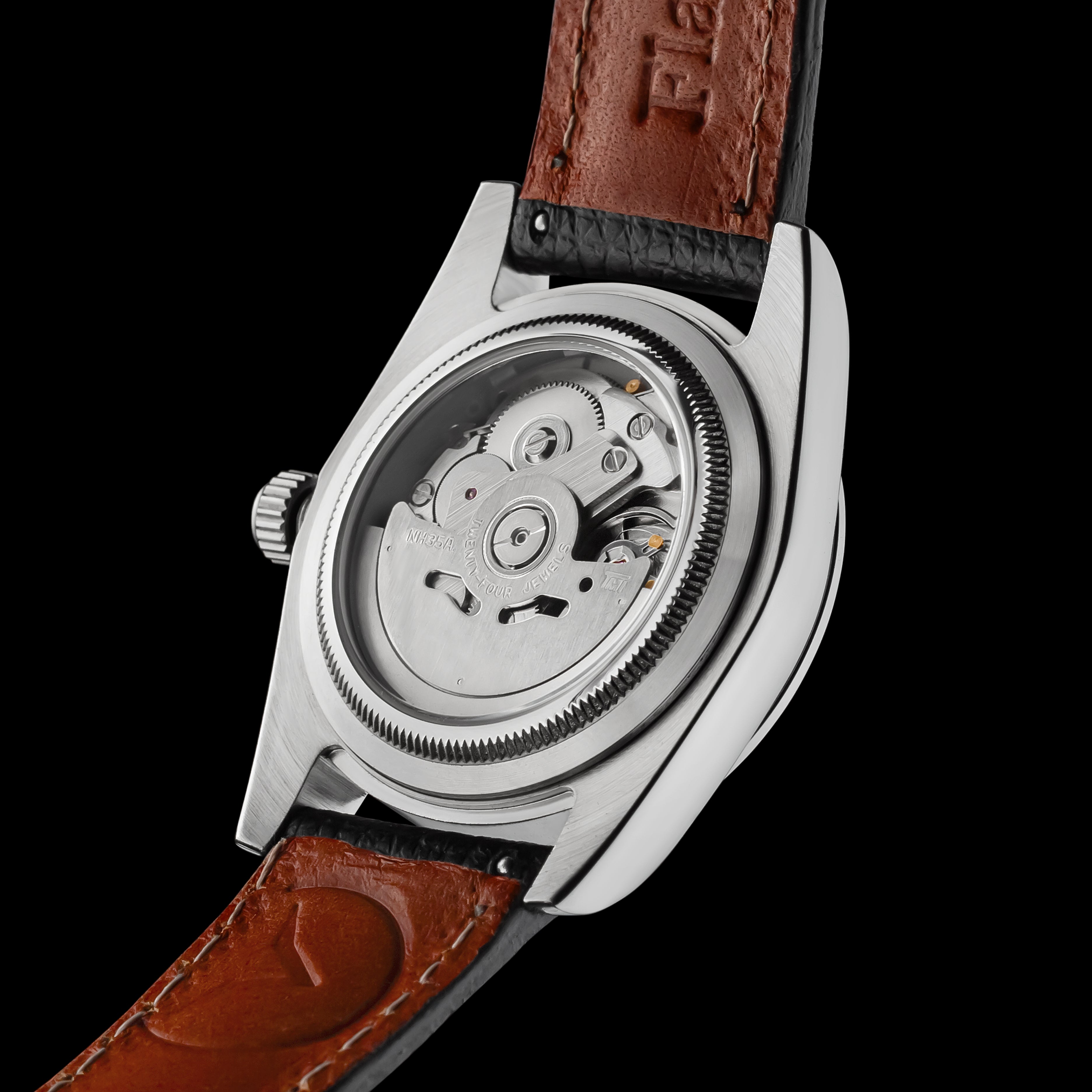 Watch with brown leather strap and visible mechanical components on a black background