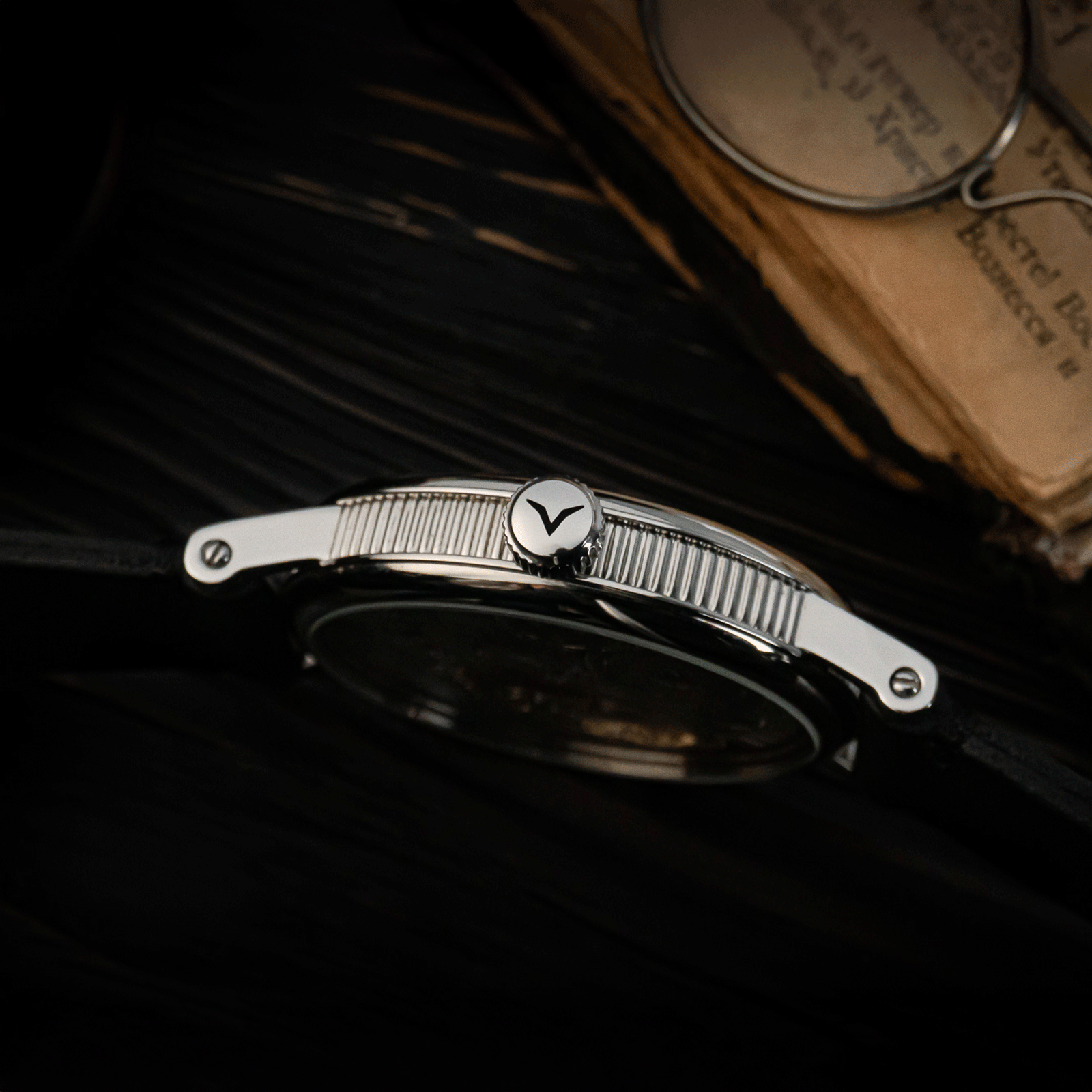 Side view of handmade watch with its crown – Adeptness