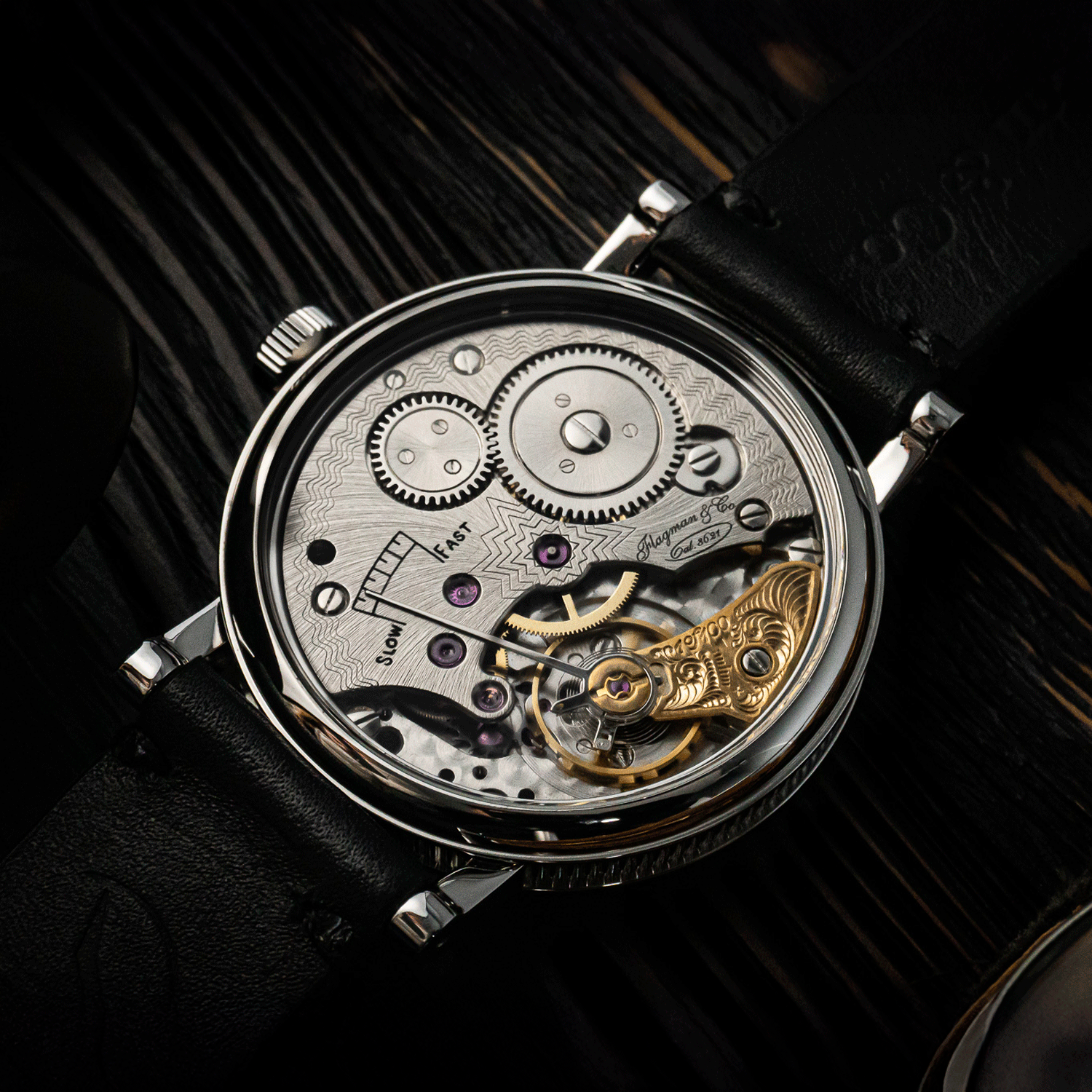 Rear view of mechanical watch Adeptness, showing caseback, with gears