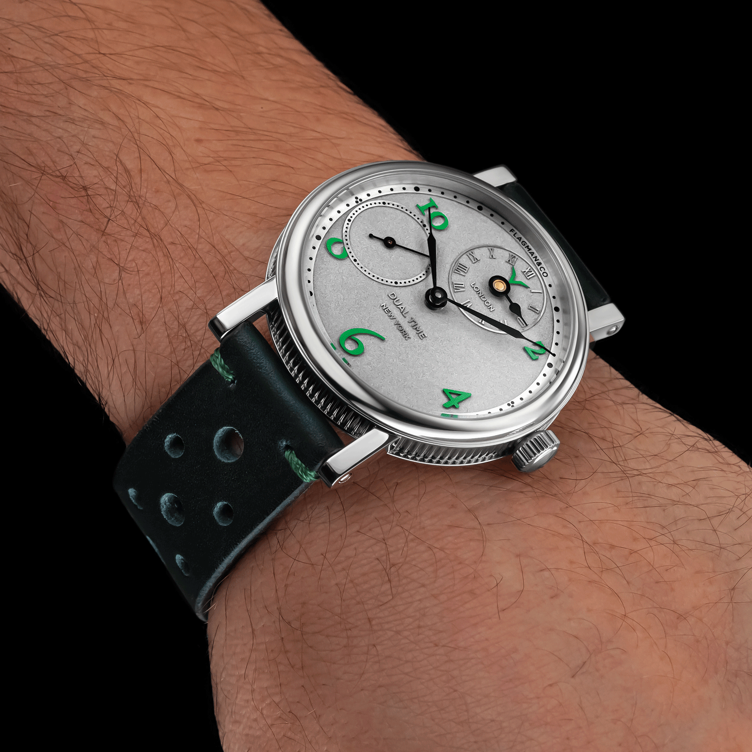 Front view of Regulator green luxury watch worn on wrist