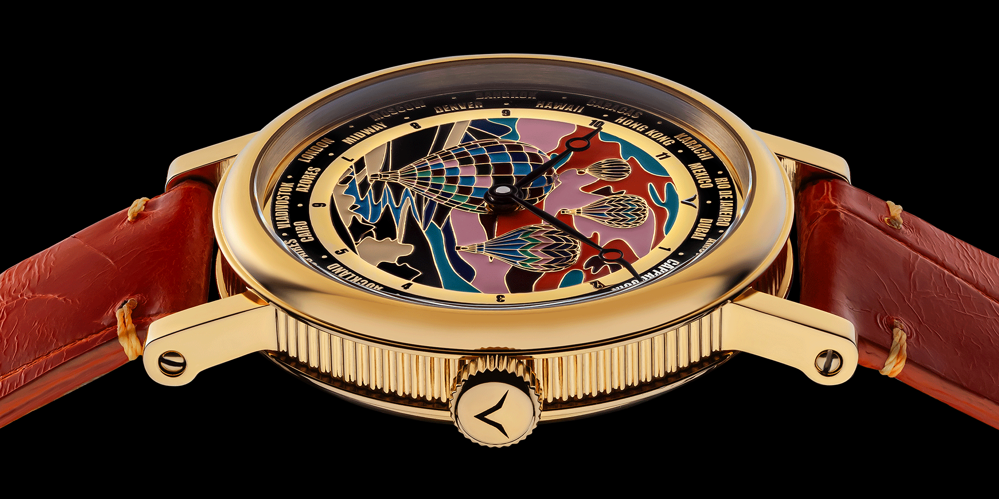 Handmade watch with a detailed face and orange leather strap on a black background