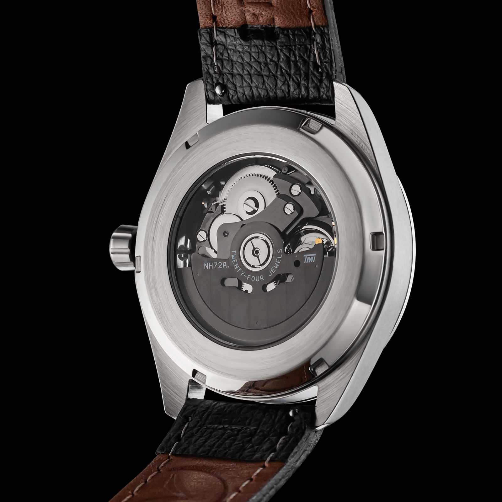 Handmade Watch with a visible mechanical movement on a black background