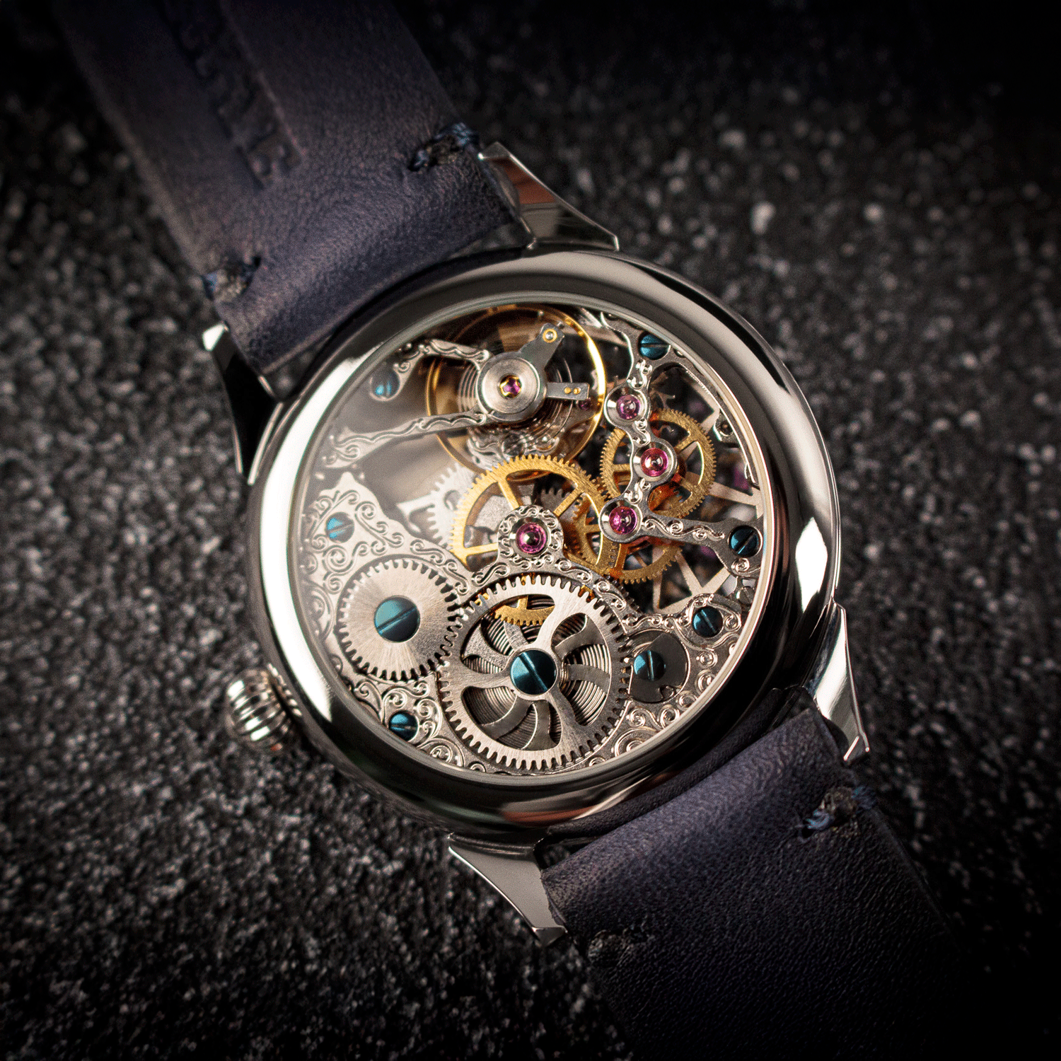 Close-up of a Skeleton mechanical watch with visible gears on a dark textured background