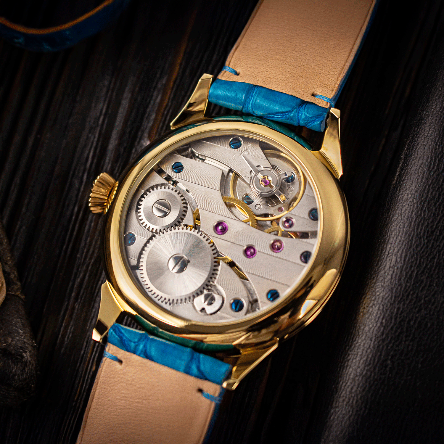 Art deco watch with blue accents on a dark background