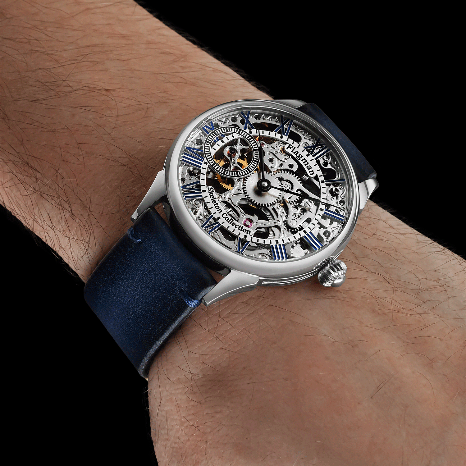 Luxury Skeleton watch with blue strap on a wrist against a black background