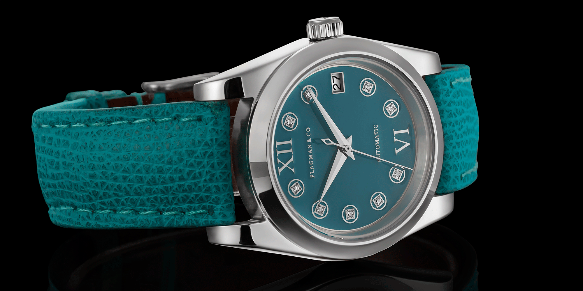 Teal wristwatch with silver case on a black background